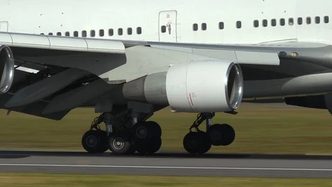 Huge airplane boeing 747 wheels touchdown landing extreme close up Stock Footage 112168739
