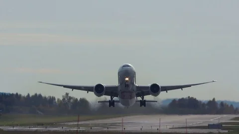 Huge airplane takeoff from runway front view Stock Footage
