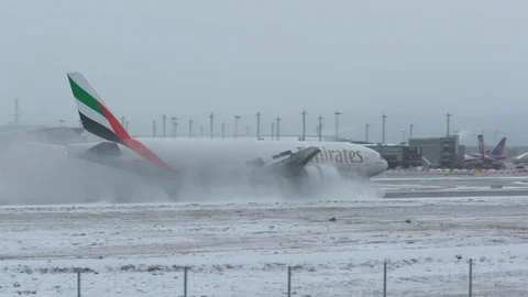 Huge airplane thrust reversal strong braking snow humid weather conditions Stock Footage 99059287