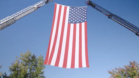 Huge American Flag Hanging Between Fire Truck Ladders Видео 334473922