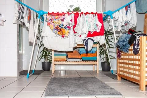 Huge amount of laundry drying in the bathroom Stock Photos