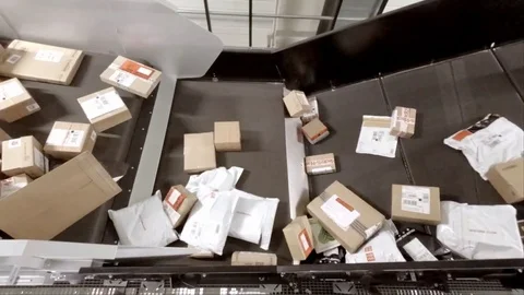 Huge amount of parcels bein transported on conveyor belts - time lapse 24 times Stock Footage 83683131