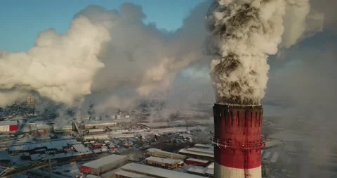 A huge amount of smoke comes out of the Industrial chimney Stock Footage 146112153
