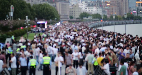Huge anonymous crowd walking on The Bund in Shanghai, blurred view Stock Footage 327649039