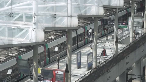 Huge architecturally designed train station terminal as train departs Stock Footage 119820878