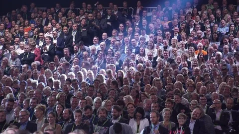 Huge audience listens to the speaker. Stock Footage