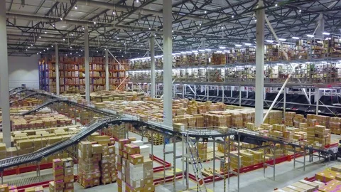 Huge automated warehouse with moving boxes on a conveyor belt Stock-Footage 122149373