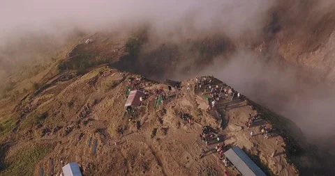 Huge Bali volcano peak surrounded by clouds during sunrise Video stock 124662822