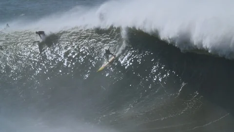 HUGE BIG WAVE SURFER Stock Footage 128940555