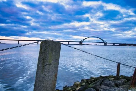 Huge blue cloudscape over the Fehmarn Sound Bridge over the Baltic Sea Stock Photos