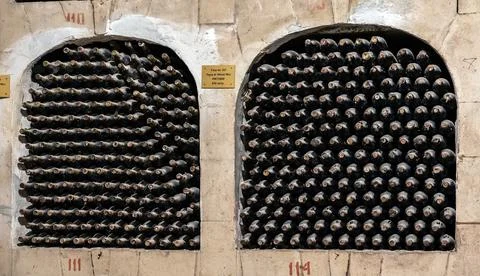 Huge bottle collection stored inside underground wine cellars tunnel Stock Photos