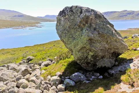 Huge boulder, big rock Vavatn lake in Hemsedal, Buskerud, Norway. Stock Photos