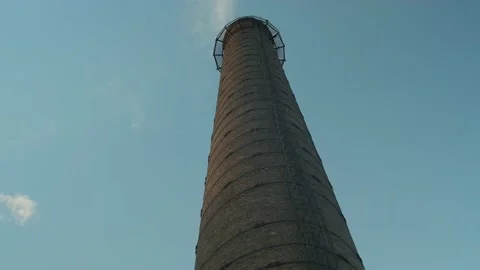 Huge brick pipe stretching into the sky, throwing co2 up into atmosphere Stock Footage 163504067
