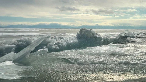 Huge broken ice hummocks falling down into water Stock Footage 178951864