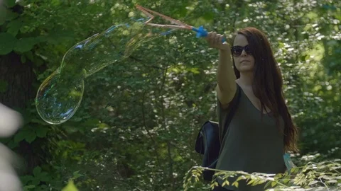 Huge Bubbles in the Forest Stock Footage 108685993