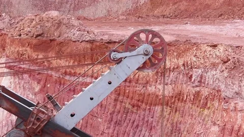 A huge bucket of a large mining excavator is gaining bauxite. Stock Footage 122215761