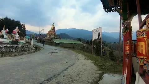 Huge buddha golden statue from different perspective with dramatic sky at eve Stock Footage 159226067