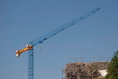 Huge building crane at work Stock Photos