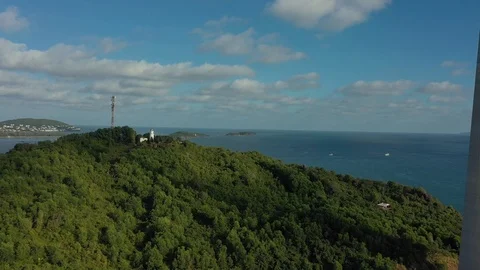 Huge cable car over several islands in Vietnam in sunset above mountain with tre Stock Footage 124367118