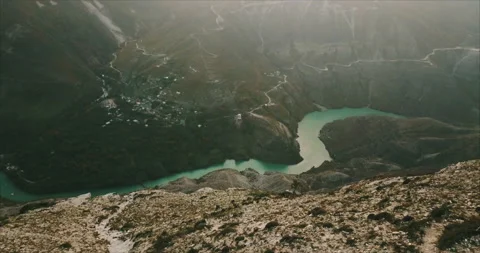 A huge canyon flowing through the mountains Stock Footage 173439375
