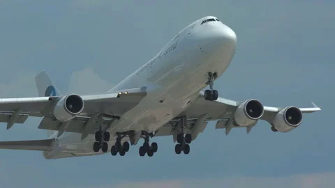 Huge cargo airplane boeing 747 cargo airlines cal jumbo jet taking off close Stock Footage 155668939
