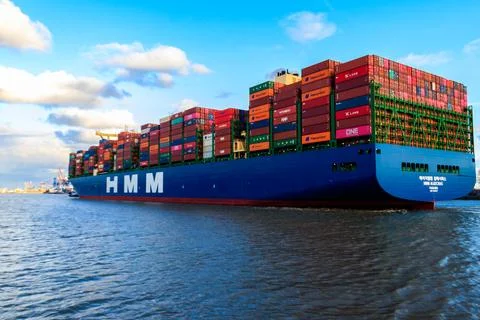 Huge cargo container ship sailing on the Elbe river, Hamburg, Germany Stock Photos