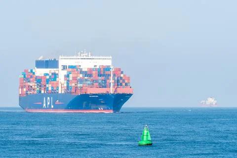 A huge Cargo Ship ariving int the Harbour of Rotterdam. Stock Photos