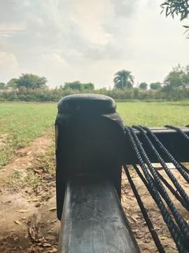 A huge Charpai was found whose strength can be estimated from its base. Stock Photos