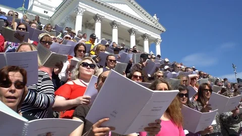 Huge choir singing on the steps of the Cathedral, Helsinki Stock Footage 75875620