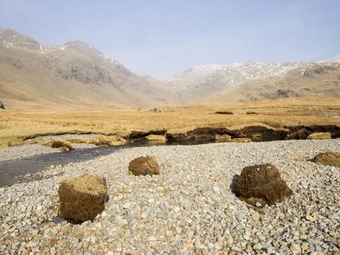 Huge chunks of peat eroded from the side of the Upper Esk by extreme flooding Stock Photos