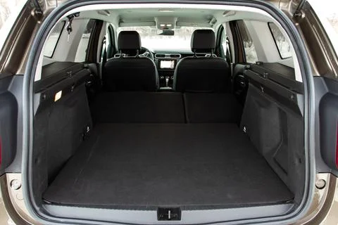 Huge, clean and empty car trunk in interior of compact suv. Rear view of a SU Stock Photos