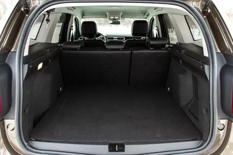 Huge, clean and empty car trunk in interior of compact suv. Rear view of a SU Stock Photos