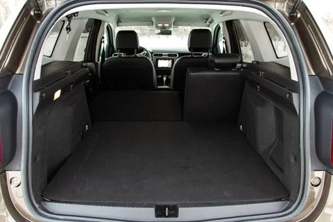 Huge, clean and empty car trunk in interior of compact suv. Rear view of a SU Stock Photos