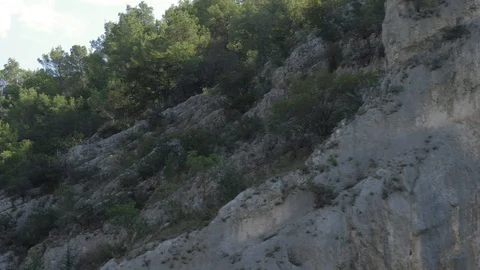 Huge cliffs at the border of a lake in the croatian national park krka. Video stock 118976506