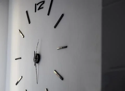 Huge clock in on the wall Stock Photos