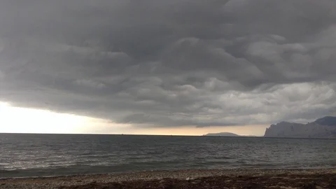 Huge Clouds and Black Sea. Calm before the storm . Karadag , Crimea , Russia Stock Footage 87095528