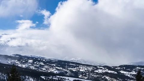 Huge clouds moving through mountains Stock Footage 310539212
