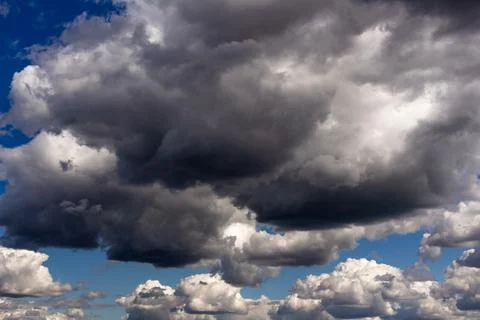 Huge clouds in the sky, sky before the storm, dramatic clouds Stock Photos