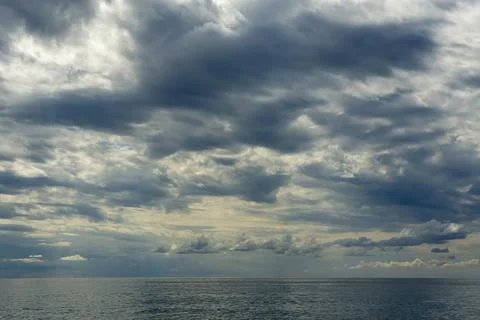 A huge cloudy sky filled with thick cumulus clouds creating a dramatic spec.. Stock Photos
