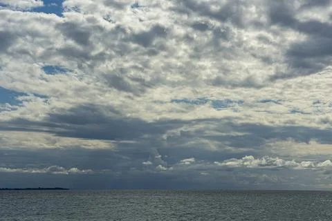A huge cloudy sky filled with thick cumulus clouds creating a dramatic spec.. Stock Photos