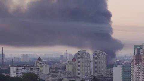 Huge column of thick black smoke rising high over Kyiv skyline  Stock Footage 338076571