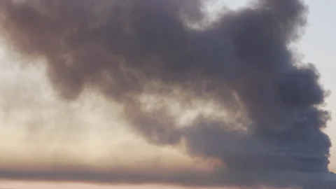 Huge column of thick black smoke rising high over Kyiv skyline  Stock Footage 338081067