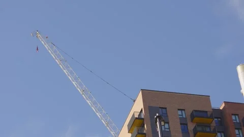 Huge Construction Tower Crane Over Apartment Building Constructing New Real Stock Footage 333499412