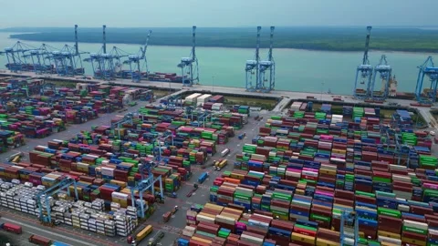 Huge Container port cargo containers cranes. Dramatic aerial view drone Stock Footage 329464733