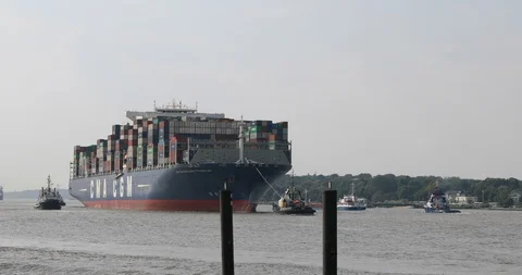 Huge container ship CMA CGM Benjamin Franklin entering Hamburg harbour Stock Footage 96723228
