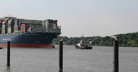 Huge container ship CMA CGM Benjamin Franklin entering Hamburg harbour Stock Footage 96723644