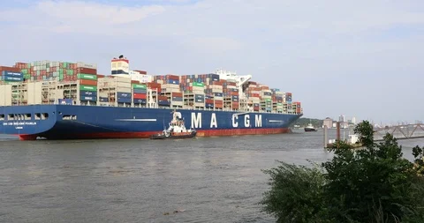 Huge container ship CMA CGM Benjamin Franklin entering Hamburg harbour Stockbeeldmateriaal 96724572