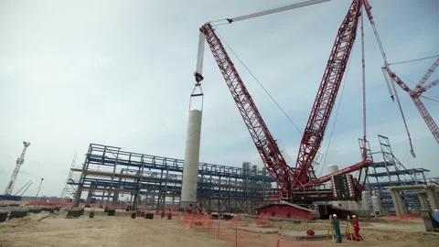 Huge cranes at work during plant construction Stock Footage 138217279