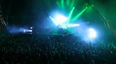 Huge crowd dancing at a concert of electronic music, great lightning effects Stock Footage 24632814