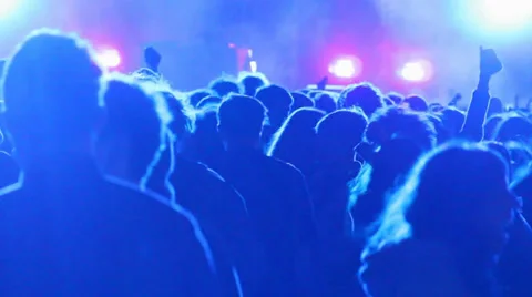 Huge crowd dancing at a DJ show, with great lightning effects. Barcelona Stock Footage 24652350